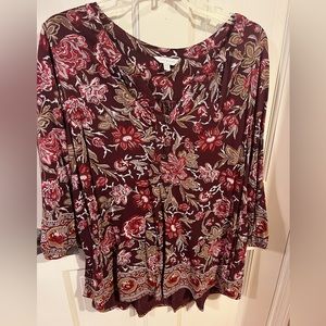 Maroon and brown floral long sleeve blouse. Four small buttons down neckline.